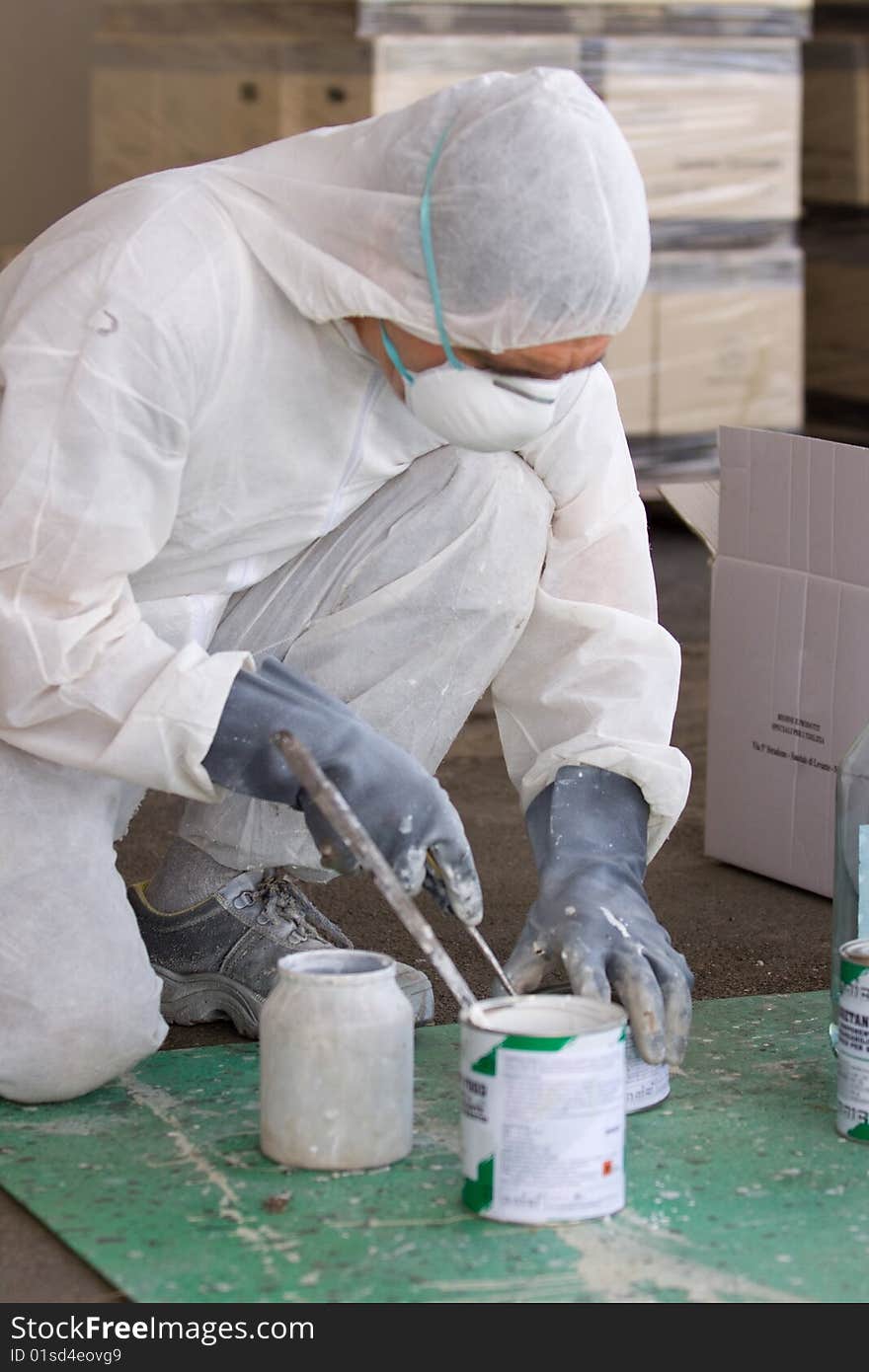 A painter at work in his construction site