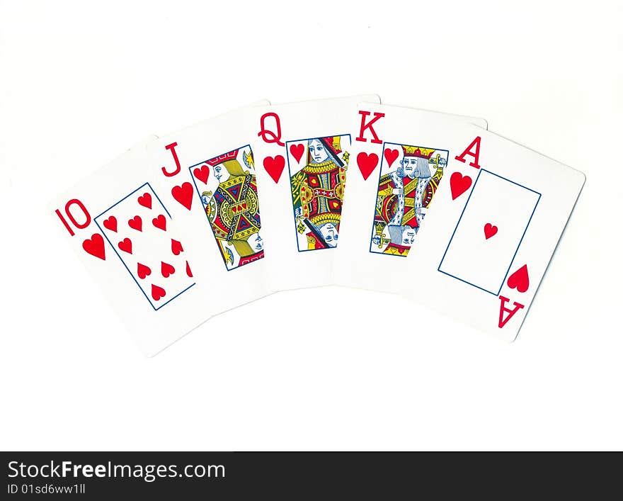 Playing cards of different colors on the table isolated on white background