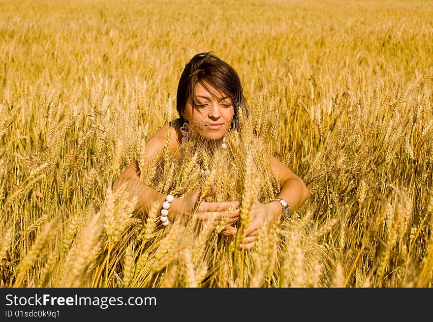 Happy women in the wheat