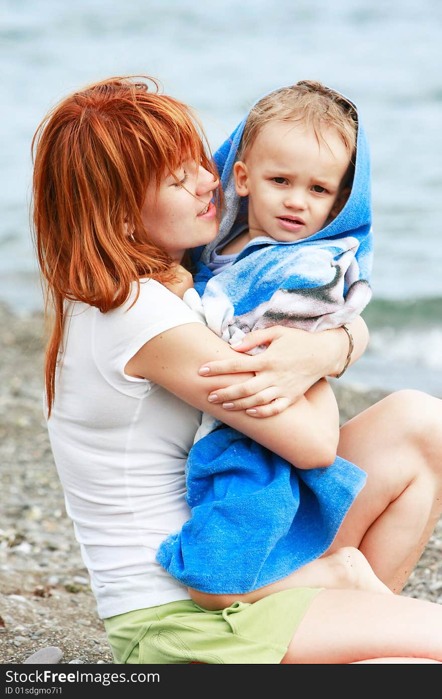 Mother and son playing on beach. Mother and son playing on beach