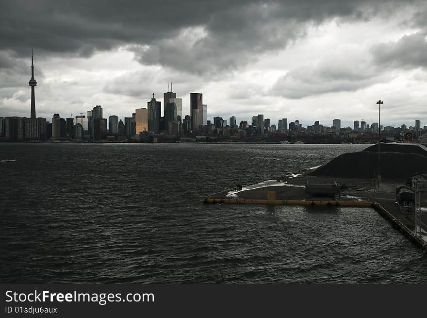 A rain storm is darkening the cityscape of Toronto. 
Seen from an elevated point at the cruise terminal. A rain storm is darkening the cityscape of Toronto. 
Seen from an elevated point at the cruise terminal