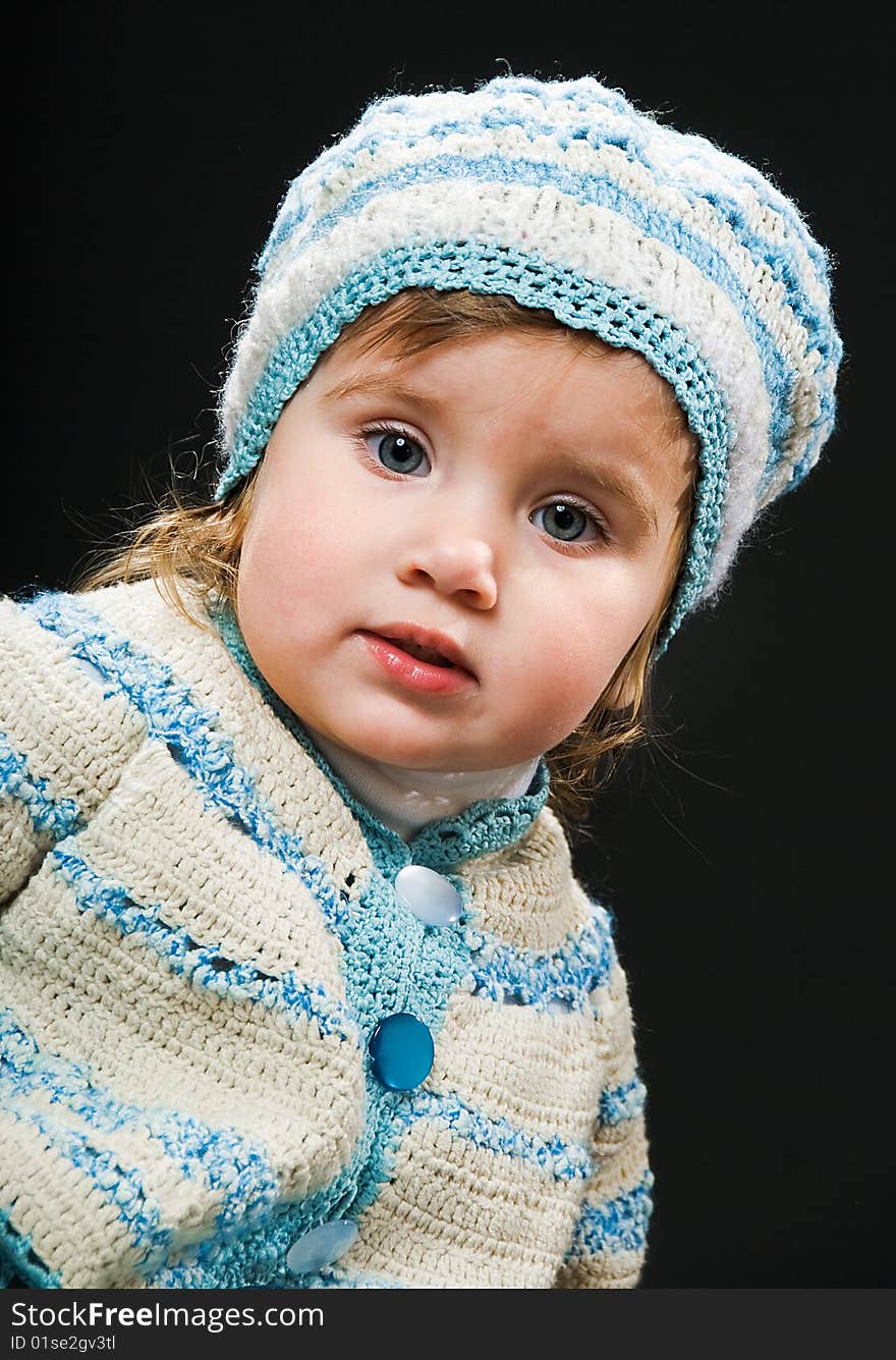 Little baby in a bound suit on black background. Little baby in a bound suit on black background