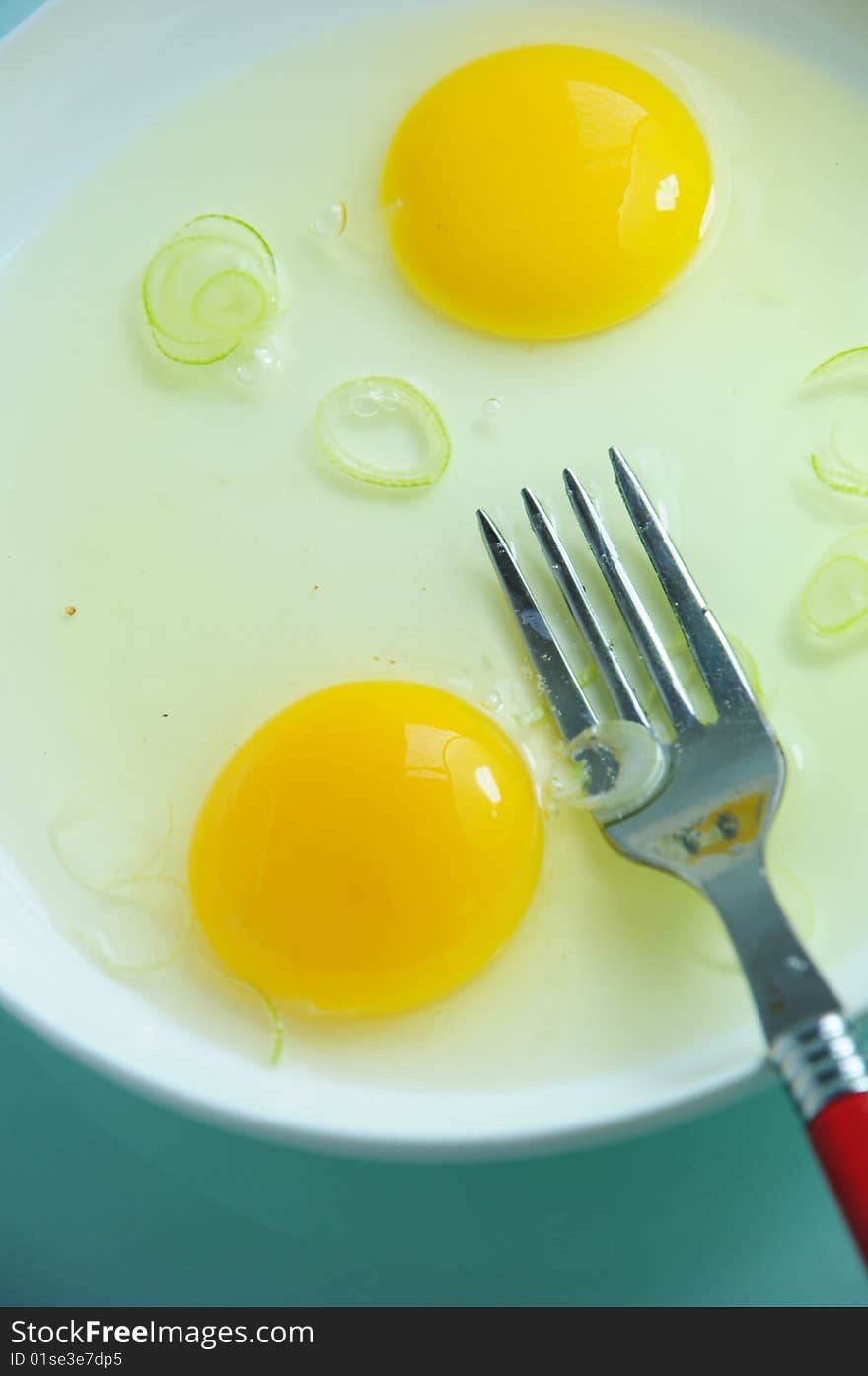 Vitelluses and fork on the plate.