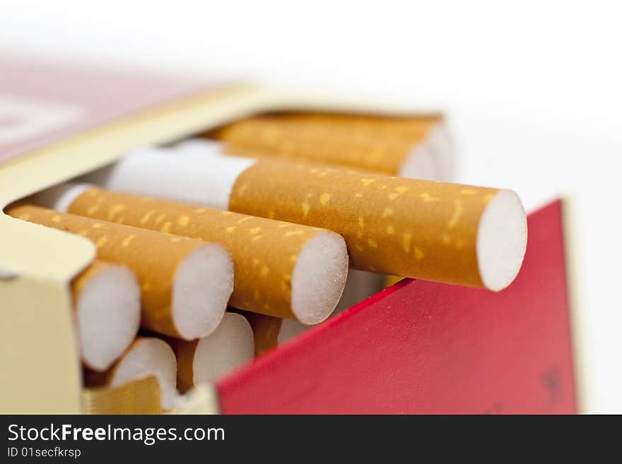 Single or pack of cigarettes with white background