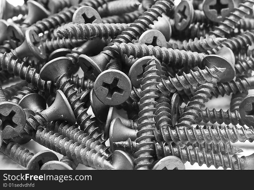 Screws and driver assorted with white background. Screws and driver assorted with white background