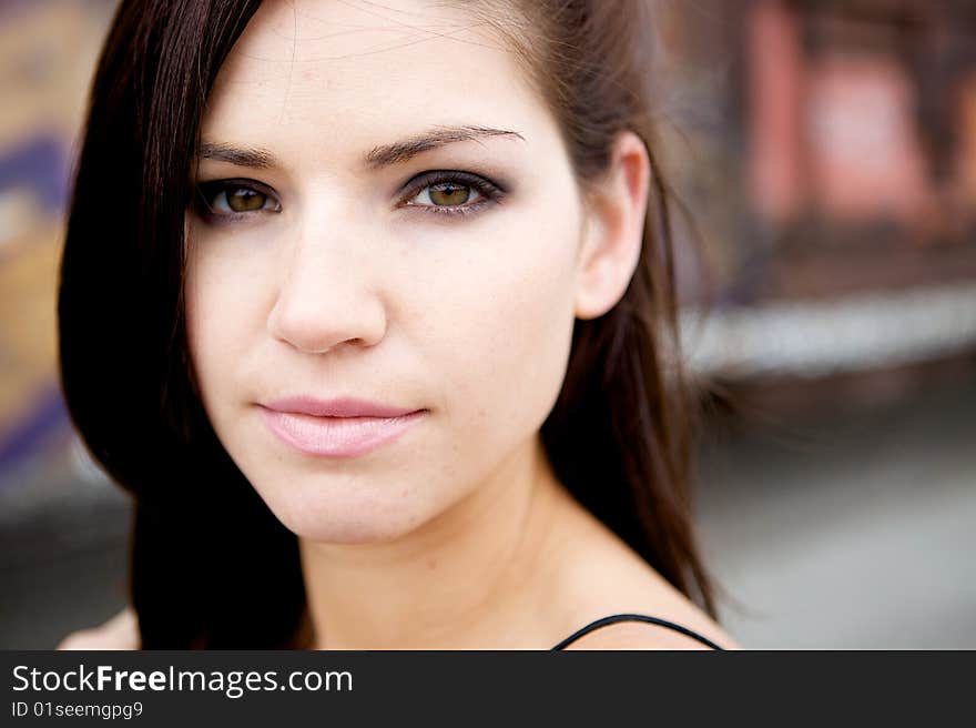 A Brunette Looking Toward The Camera with an edgy look. A Brunette Looking Toward The Camera with an edgy look