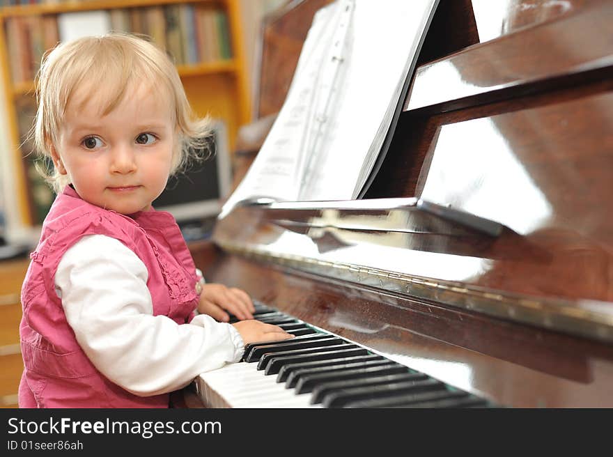 Girl plays  piano