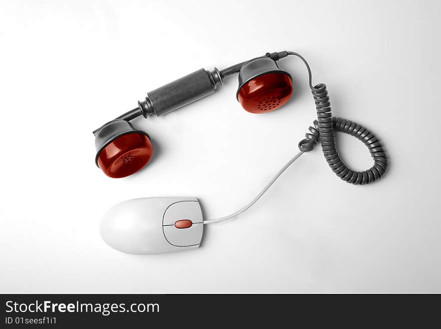 Telephone horn hung to computer mouse. Telephone horn hung to computer mouse