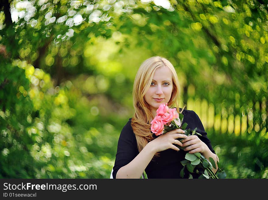 Young woman with five roses  portrait. Young woman with five roses  portrait