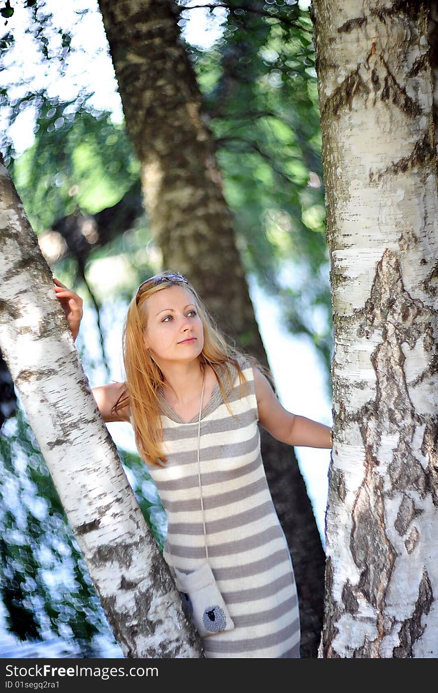 Beautiful young woman in park portrait