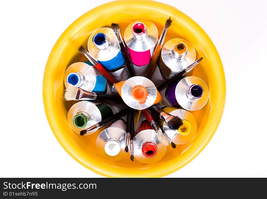 Tube of paint on yellow pail