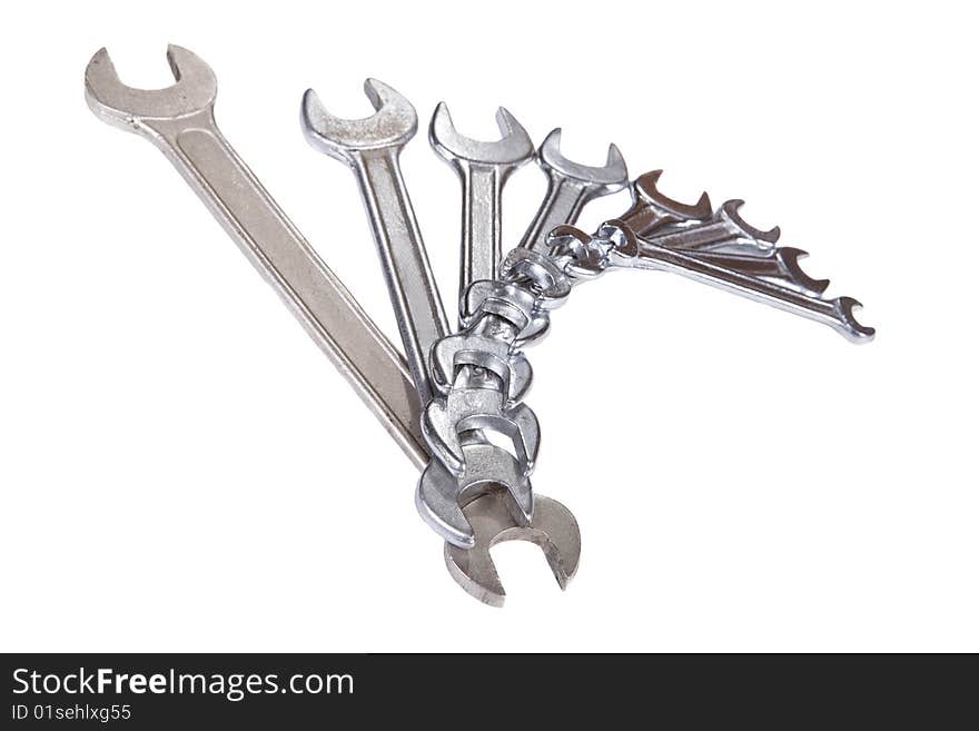 Silver spanner on white background