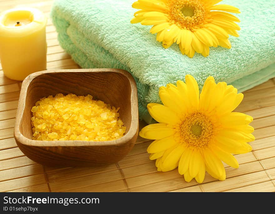 Spa essentials. Bath salt, towel, candle and gerber.