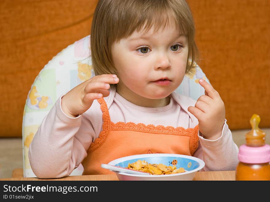 Sweet toddler baby girl eating