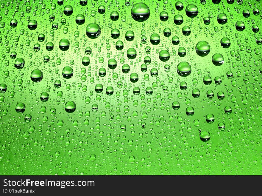 Water drops against green background. Water drops against green background