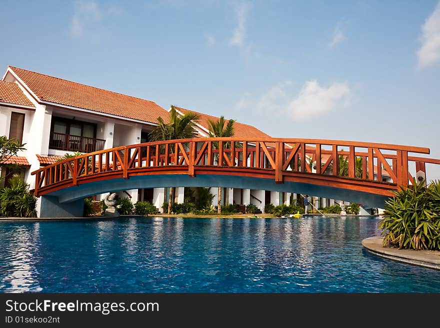 Bridge over a pool at a tropical resort in India. Bridge over a pool at a tropical resort in India.