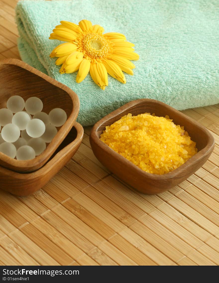 Spa essentials. Bath salt, towel, and gerber.