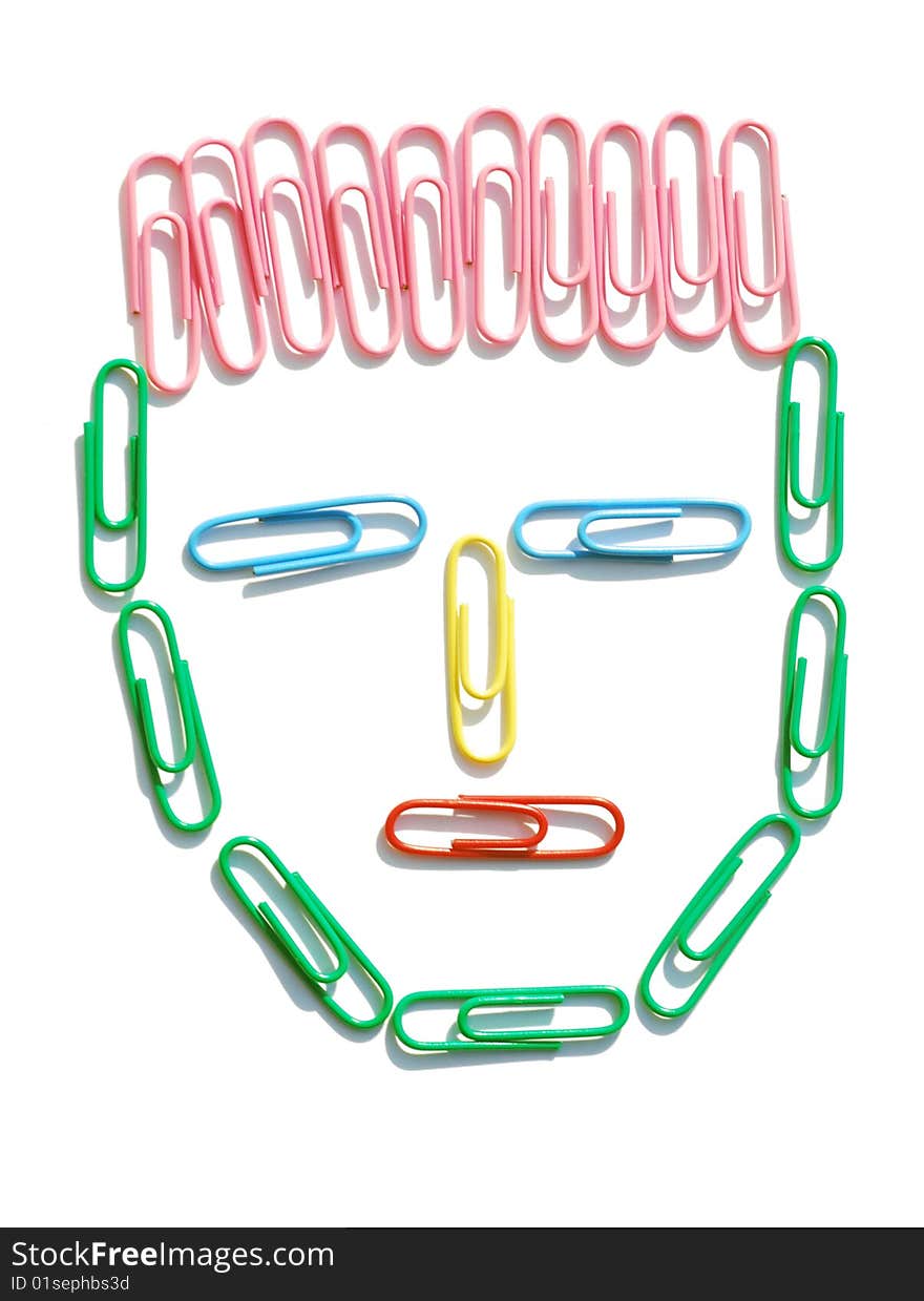 Colored paper clips in the shape of head. Colored paper clips in the shape of head