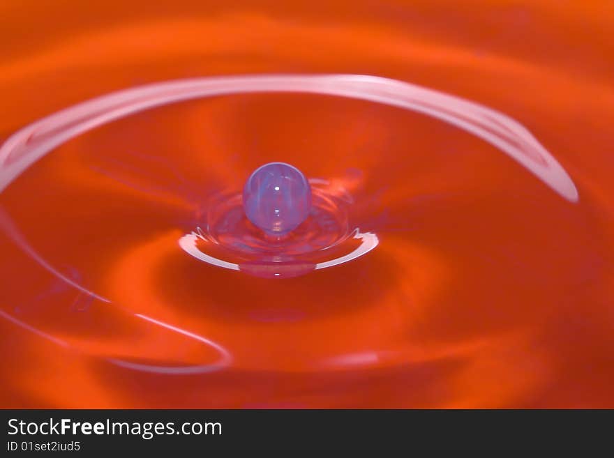 This Water Drop Looks like a Marble as it gets ready to hit a bowl of water.