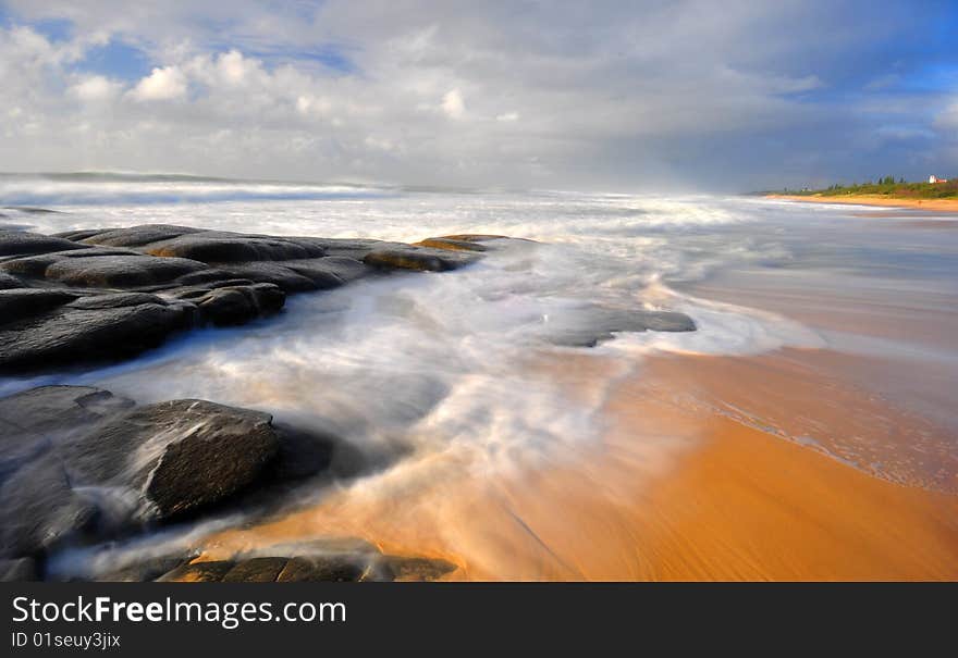 Early morning at the beach with flowing water. Early morning at the beach with flowing water