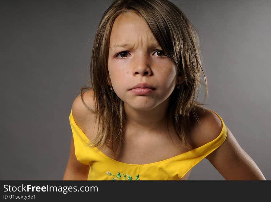 Portrait of upset girl with serious attitude