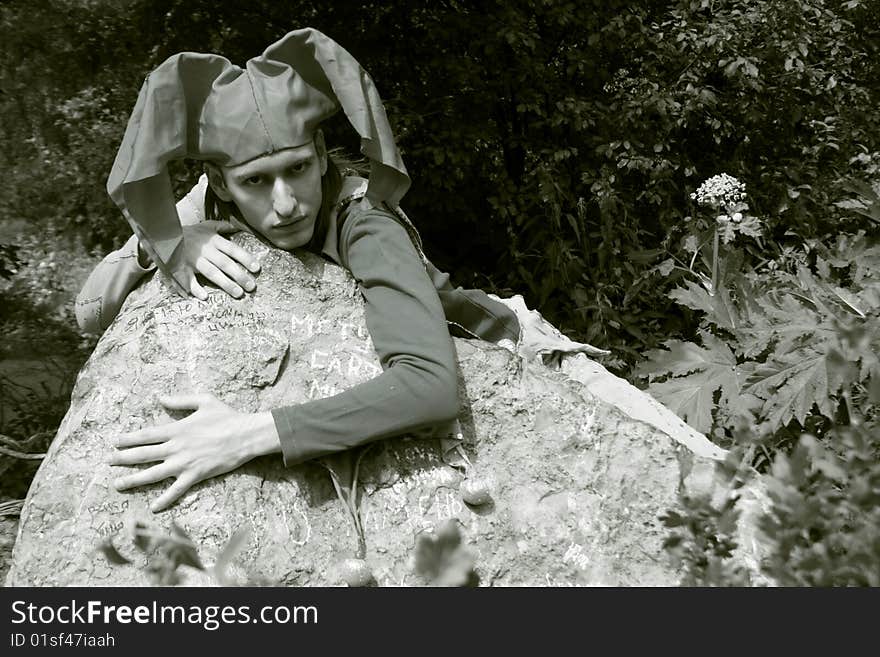 Man dressed in a clown`costume walking outdoor. Man dressed in a clown`costume walking outdoor