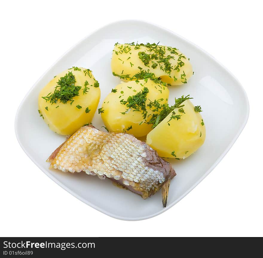 Close-up plate of potato with fish isolated on white background