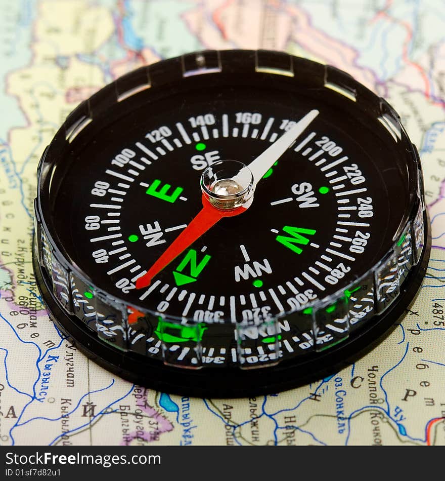 Compass over map background