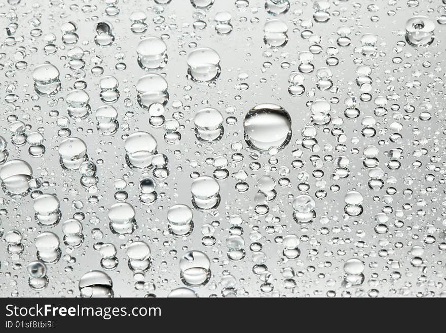 Water drops over a mirror