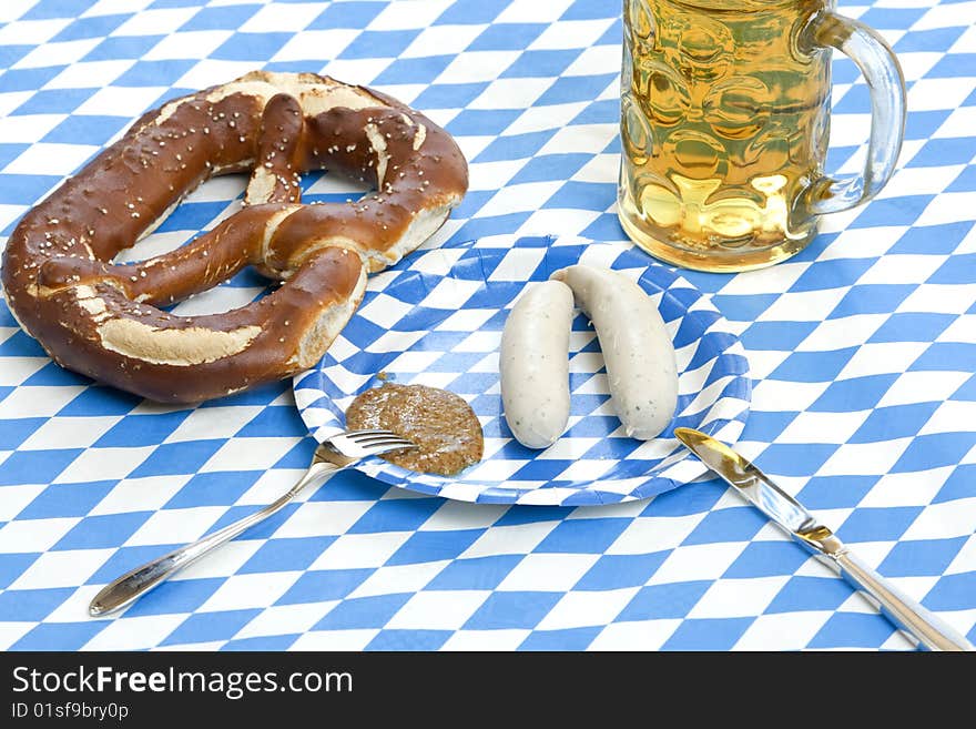 Original Bavarian Oktoberfest Pretzel, Beer Stein (mug) and sausages called weisswurst in German. Original Bavarian Oktoberfest Pretzel, Beer Stein (mug) and sausages called weisswurst in German