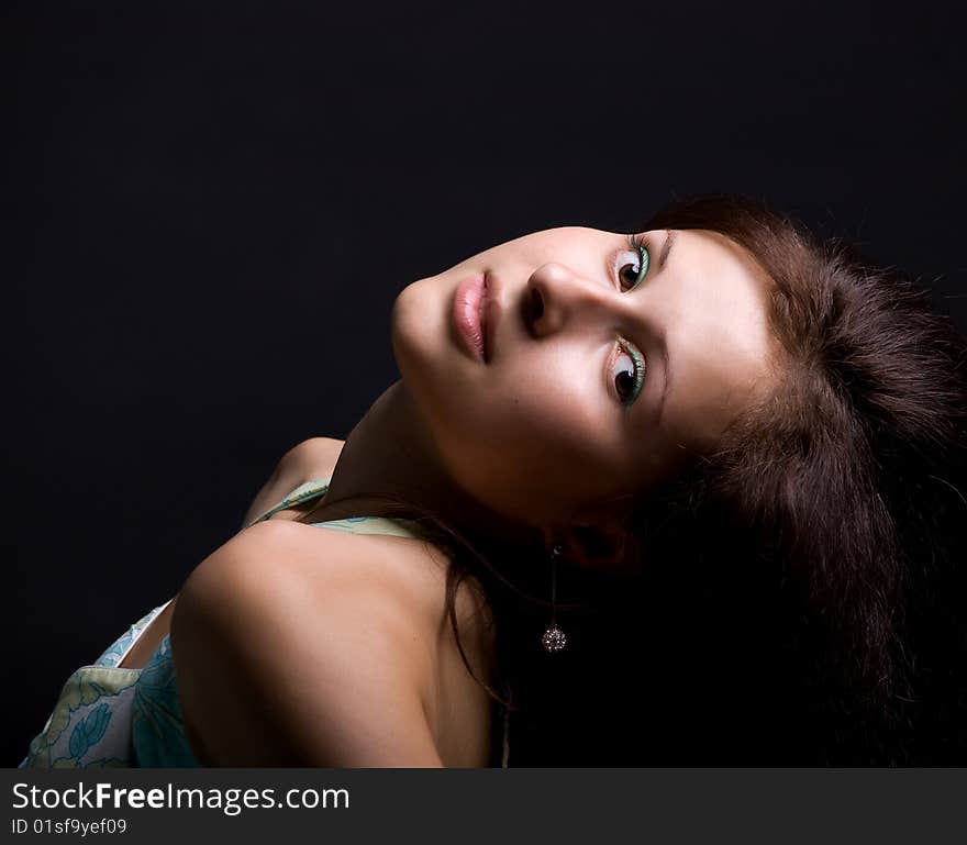 Cute teenager. Isolated on a  black background