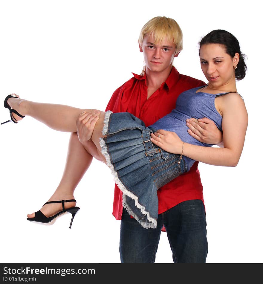 Young couple. Man holds girl in his arms. Isolated.