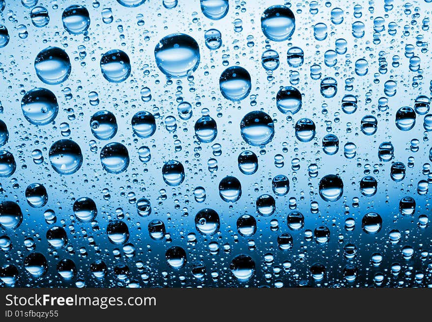 Water drops against blue background. Water drops against blue background