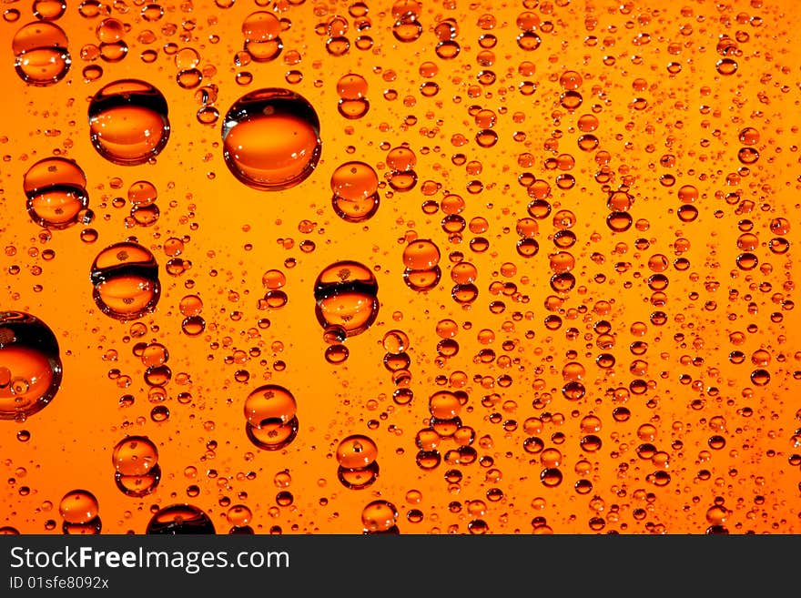 Macro of orange water drops