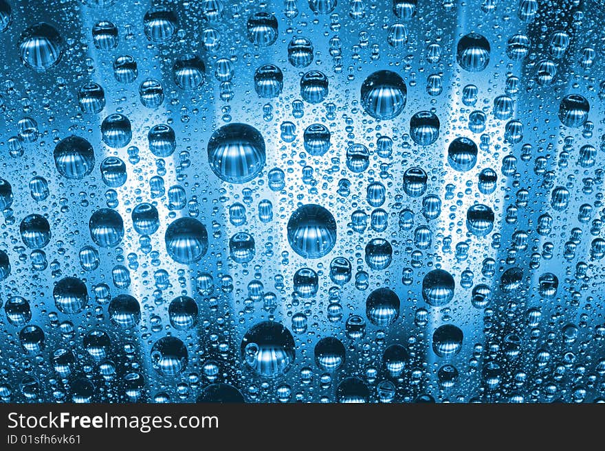 Water drops against blue background. Water drops against blue background