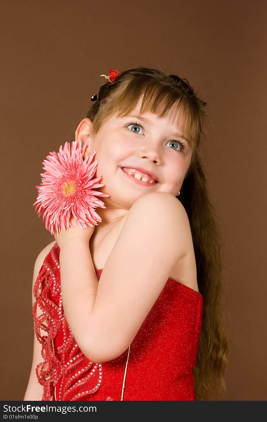 An image of a nice girl with pink flower. An image of a nice girl with pink flower