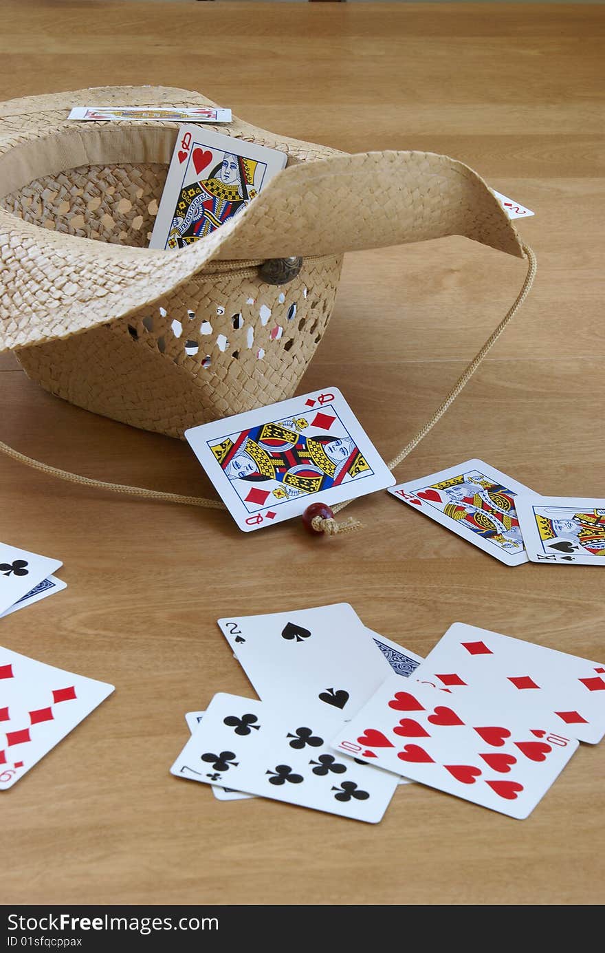 A game of tossing cards into a hat.