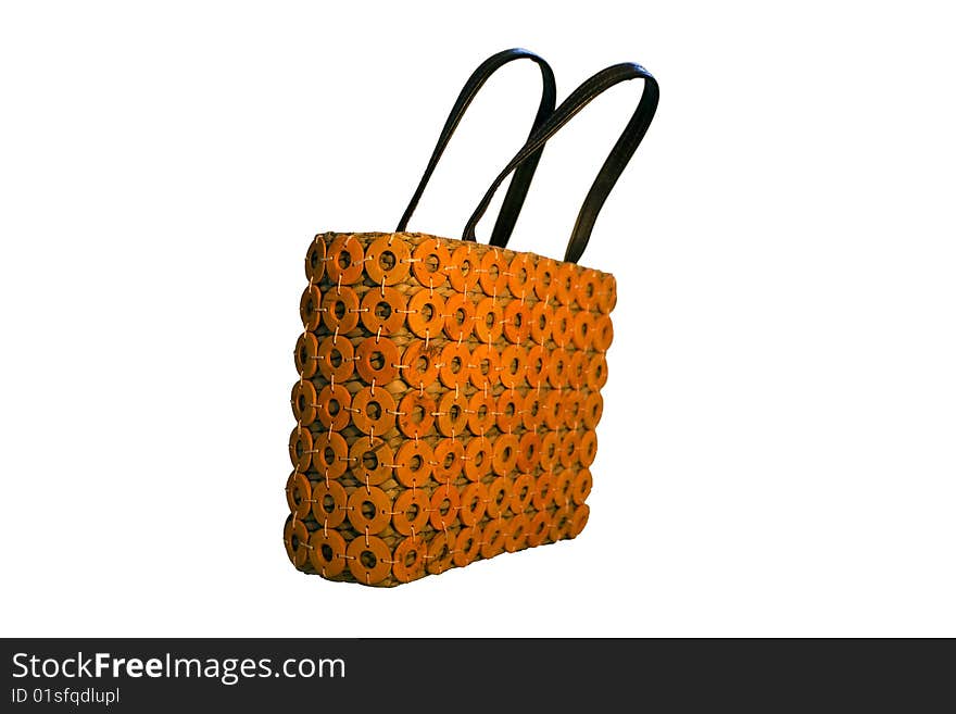 A womans bag made out of wood and straw together with some orange textile- isolted on white. A womans bag made out of wood and straw together with some orange textile- isolted on white