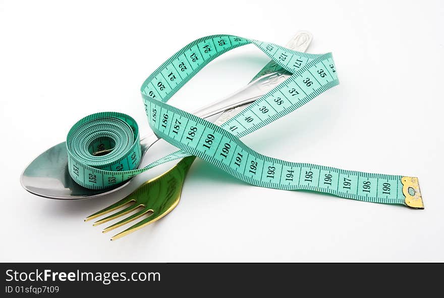 Cutlery with a measuring tape, diet, moderate eating. Cutlery with a measuring tape, diet, moderate eating