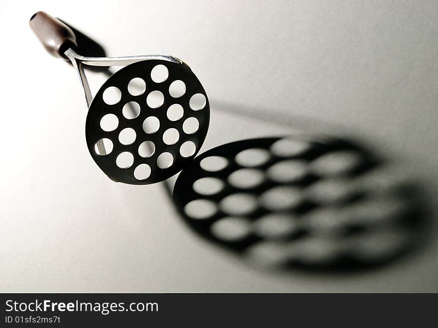 Kitchen spoon and her shade on a white background. Kitchen spoon and her shade on a white background