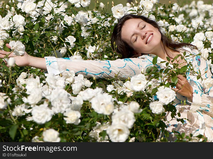 Fine young women in roses