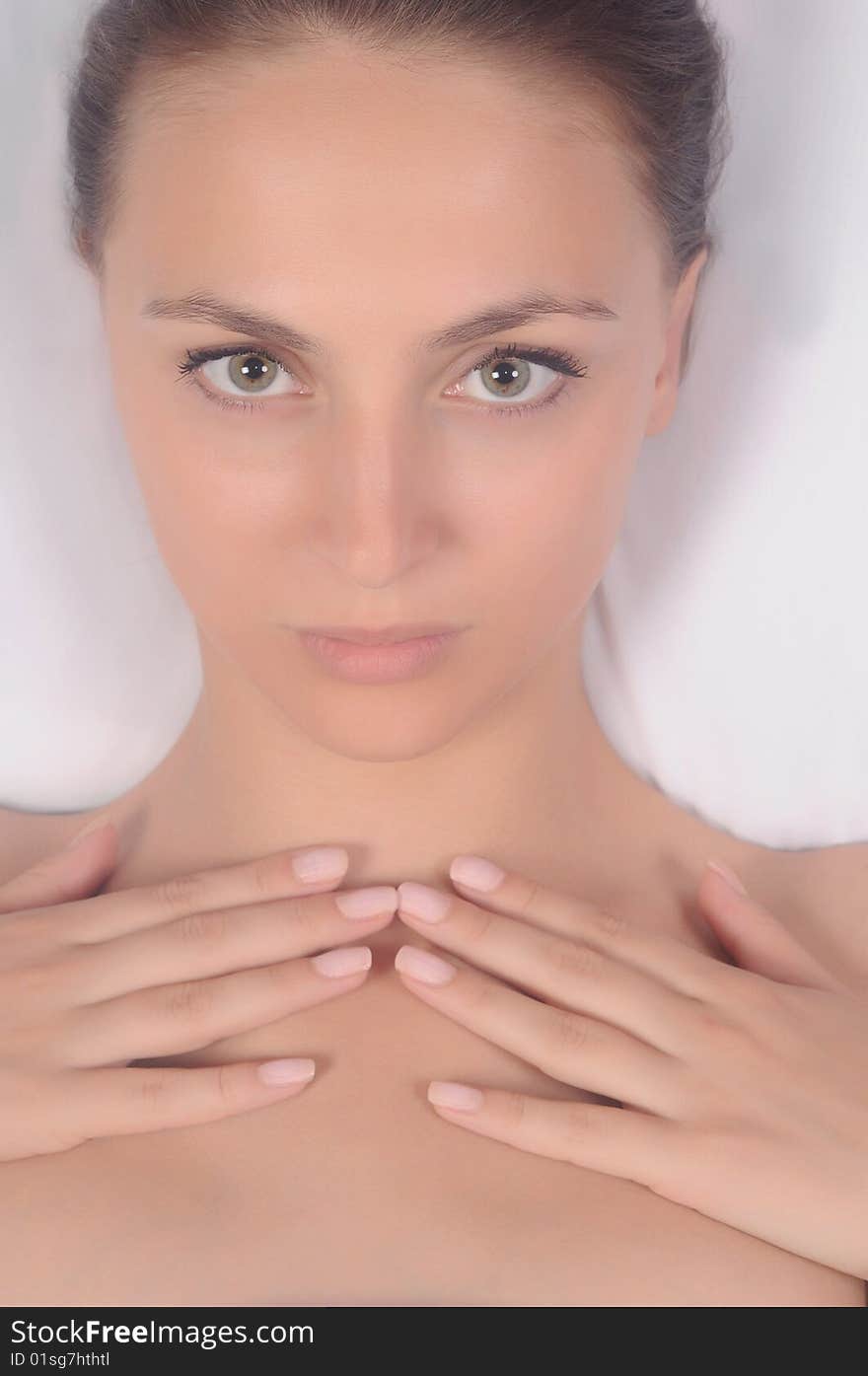 Portrait of the beautiful girl on a white background