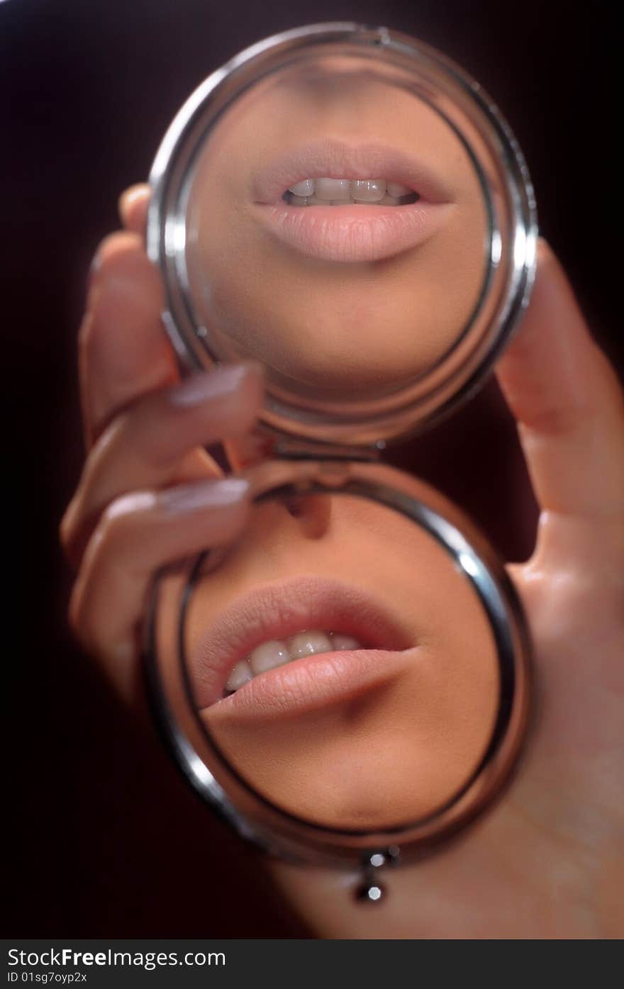 Beautiful lips are reflected in a mirror. Beautiful lips are reflected in a mirror