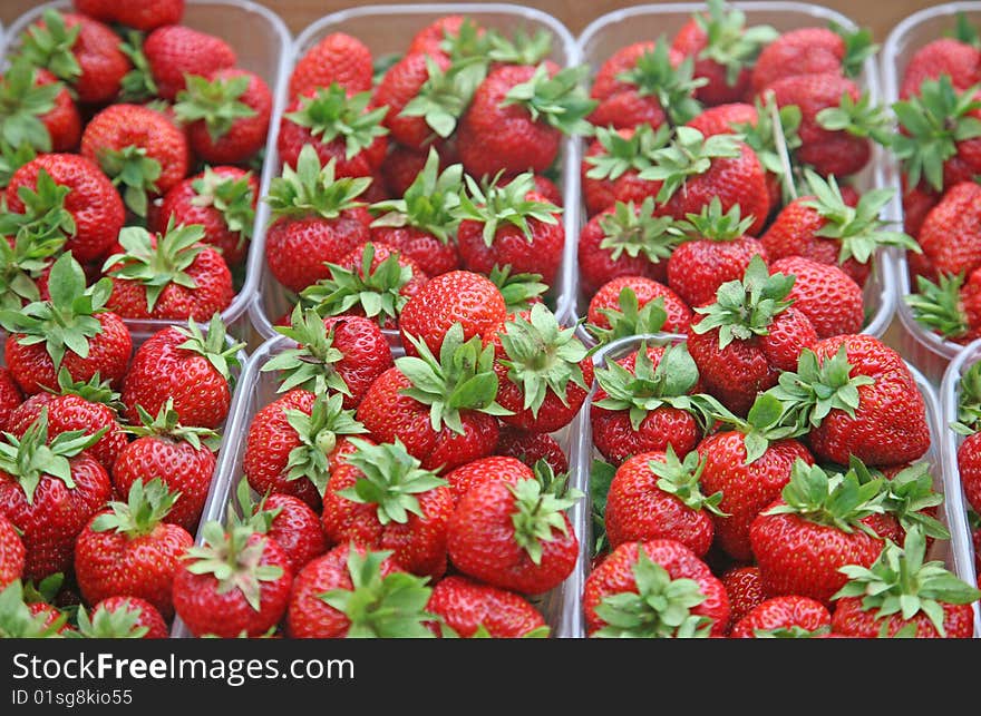 Fresh large strawberry close up in plastic trays. Fresh large strawberry close up in plastic trays