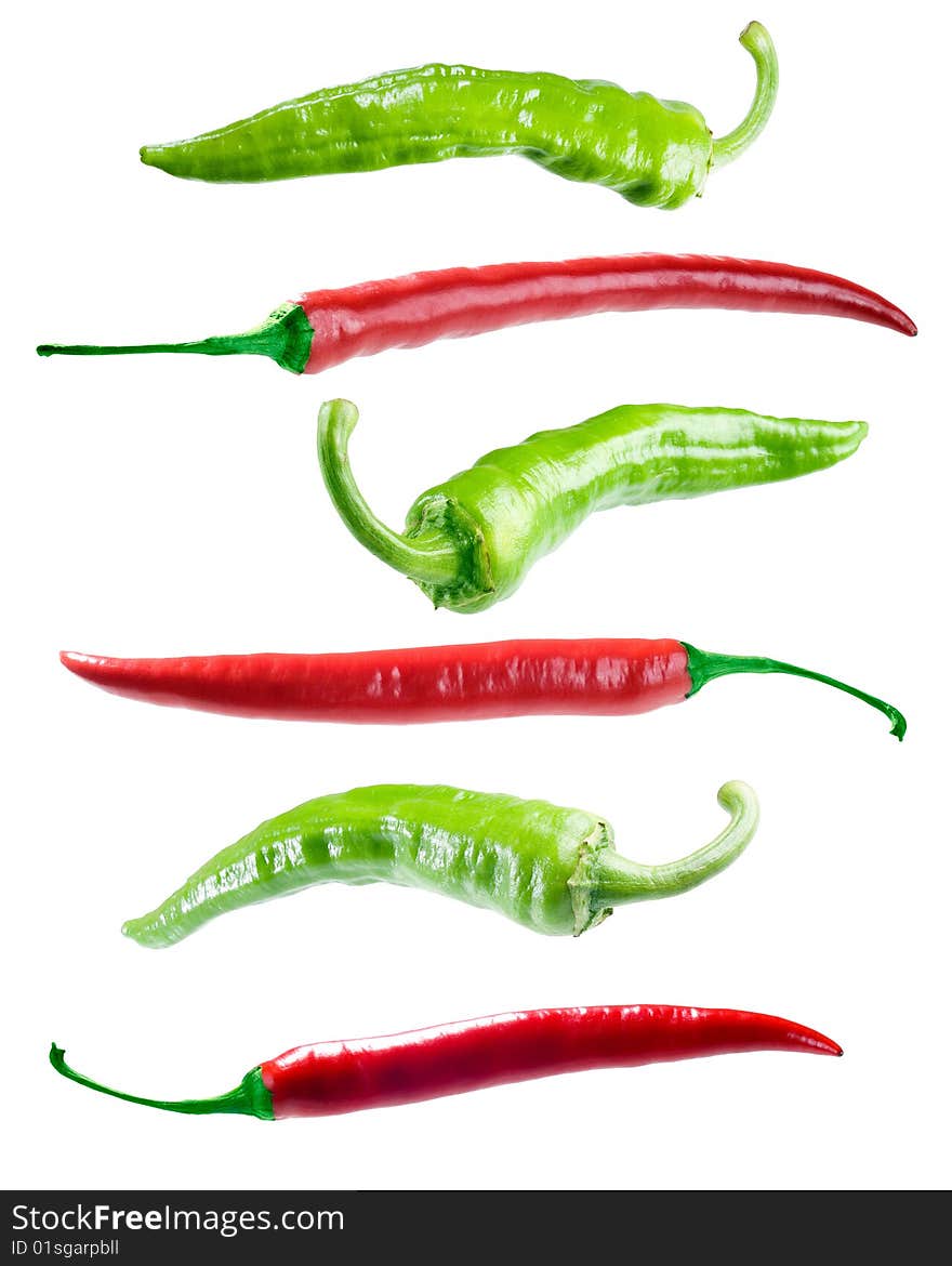 Green and red peppers on white background (isolated). Green and red peppers on white background (isolated).