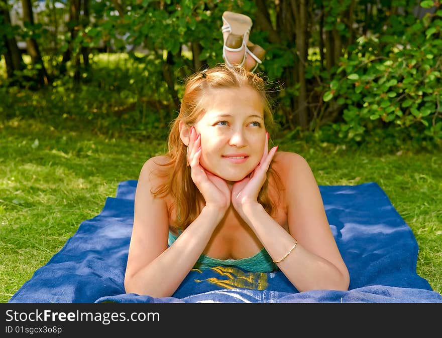 Young woman laying on the grass