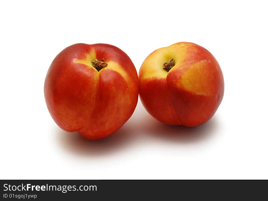 Two nectarines isolated on white