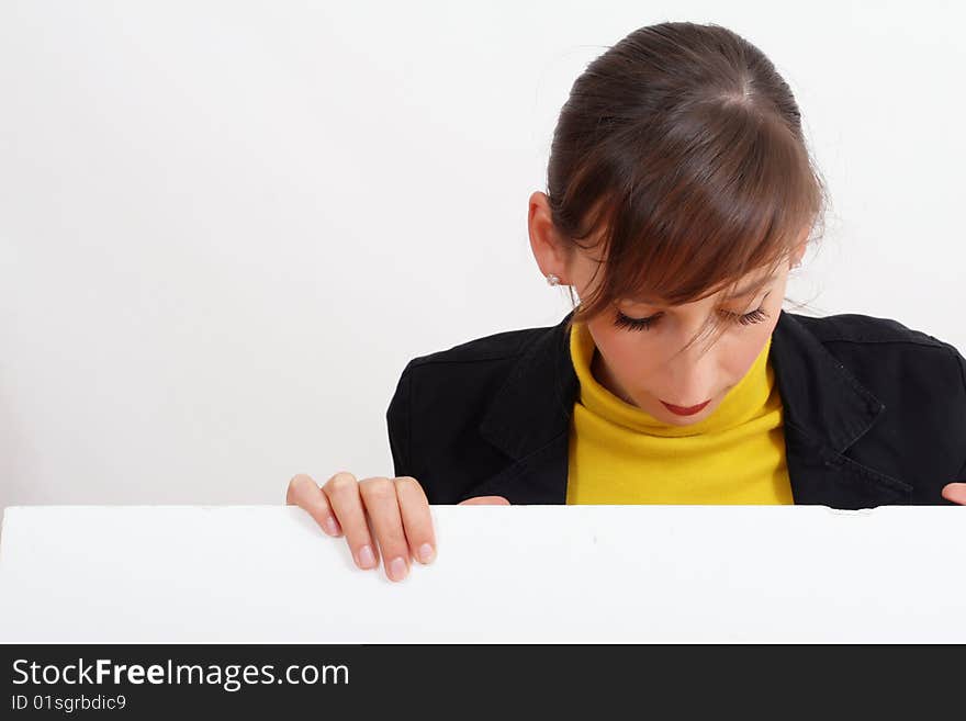 Smiling woman with a blank bulletin board over white. Smiling woman with a blank bulletin board over white