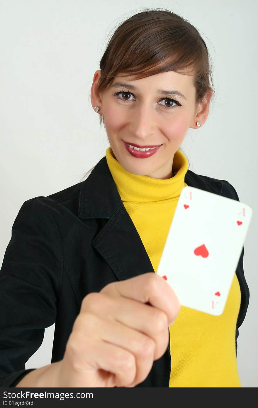 Woman holding a playing card in the hand. Woman holding a playing card in the hand