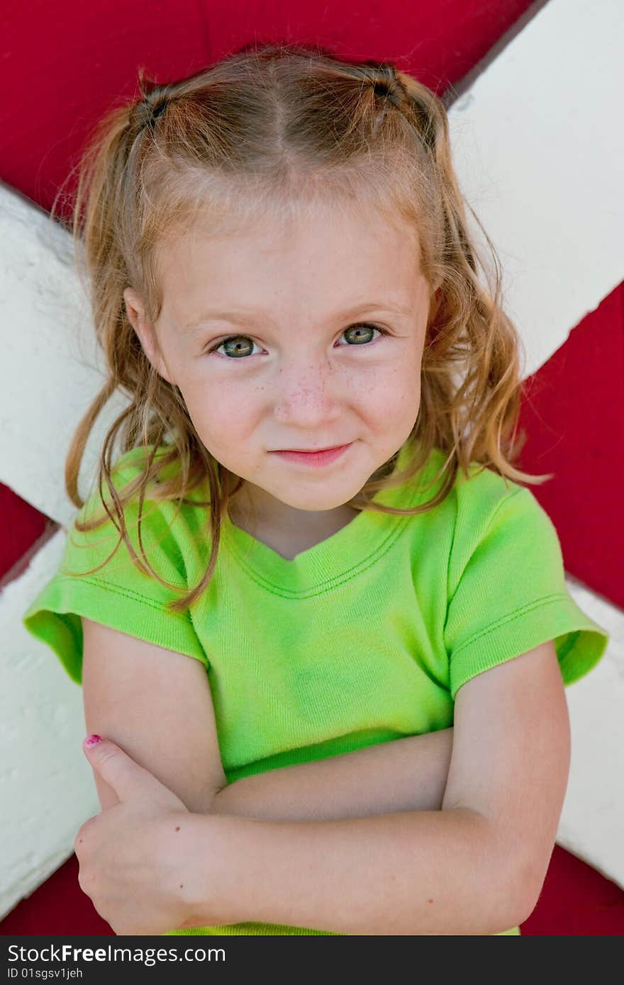 Four year old standing in front of barn door with arms crossed. Four year old standing in front of barn door with arms crossed.